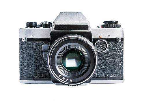 Retro film photo camera isolated on white