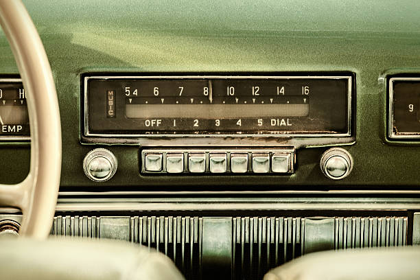Retro styled image of an old car radio Retro styled image of an old car radio inside a green classic car noise photos stock pictures, royalty-free photos & images