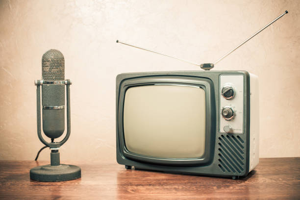 Retro television and old microphone from 50s. Vintage instagram style filtered photo stock photo