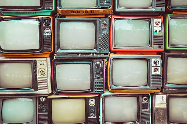 retro tv Pattern wall of pile colorful retro television (TV) - vintage filter effect style. clock photos stock pictures, royalty-free photos & images