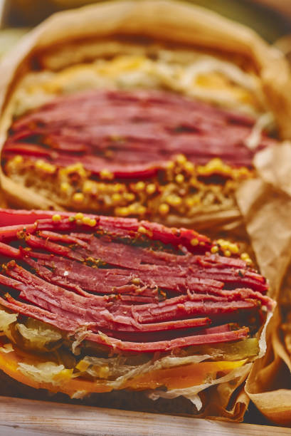 Reuben sandwich. Classic traditional American sandwich. Pastrami and corned beef on grilled bread stock photo
