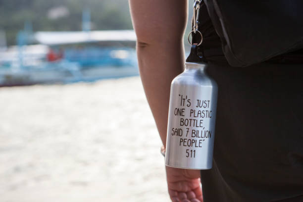 Reusable water bottle with text Reusable water bottle with text reusable water bottle stock pictures, royalty-free photos & images