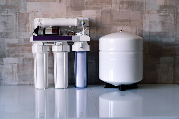 Reverse osmosis water purification system at home. Installed water purification filters. Clear water concept stock photo