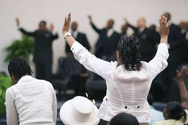 Revival Congregation with their pastors at a revival. church stock pictures, royalty-free photos & images