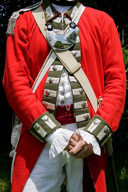 Revolutionary War -- Loyalist Officers Uniform A reenactor portraying an officer in the Maryland Loyalist Army during the Revolutionary War.  These soldiers lived in Maryland but fought for the King of England to try to surpress the uprising of the Continental Army during the American Revolution.  historical reenactment stock pictures, royalty-free photos & images