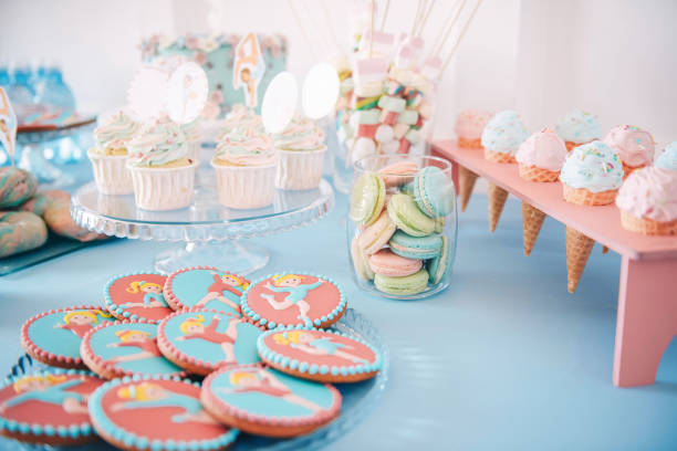 Rhythmic gymnastics Candy Bar Rhythmic gymnastics Candy Bar. Tasty cupcakes, glazed rhythmic gymnastics shaped cookies, macaroons. Delicious sweet buffet.  Catering buffet for events. nn girls stock pictures, royalty-free photos & images