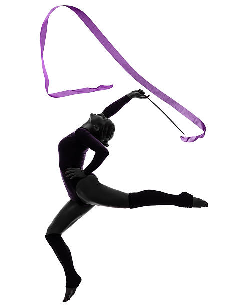 Rhythmic Gymnastics with ribbon woman silhouette one caucasian woman exercising Rhythmic Gymnastics with ribbon in silhouette studio on white background gymnastic silhouette stock pictures, royalty-free photos & images