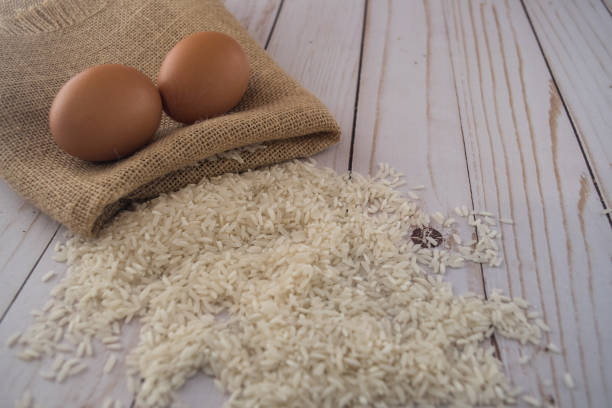 Rice and burlap bag with eggs stock photo