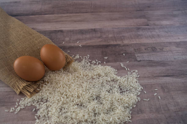 Rice and burlap bag with eggs stock photo