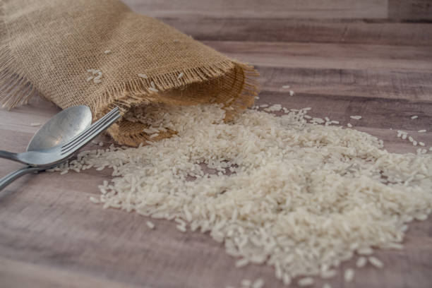 Rice and burlap bag with silverware stock photo