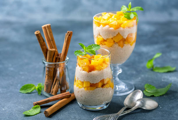 Rice pudding with peach slices for breakfast. stock photo