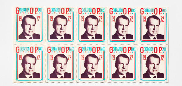 Pasadena, Maryland, USA - November 27, 2011: Close-up of faded political campaign stickers from the 1972 Republican Presidential bid for re-election of Richard Nixon. The slogan was Generation Of Peace. Nixon resigned in 1974 over the Watergate scandal. He was the first President to resign from office.