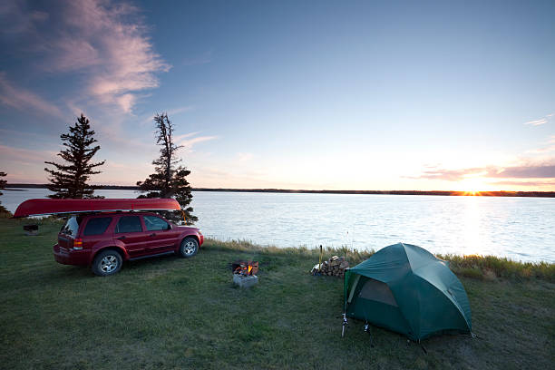 Riding Mountain National Park View of Lake Audy, Riding Mountain National park, Manitoba, Canada. Camping with a sunset. sports utility vehicle stock pictures, royalty-free photos & images