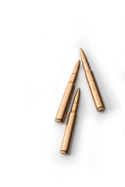 Rifle cartridge, two bullets High angle view of two bullets on white nra stock pictures, royalty-free photos & images