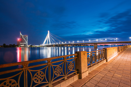 Riga Latvia. View From Deserted Embankment Of Daugava To Vansu Cable-Stayed Bridge In Illumination