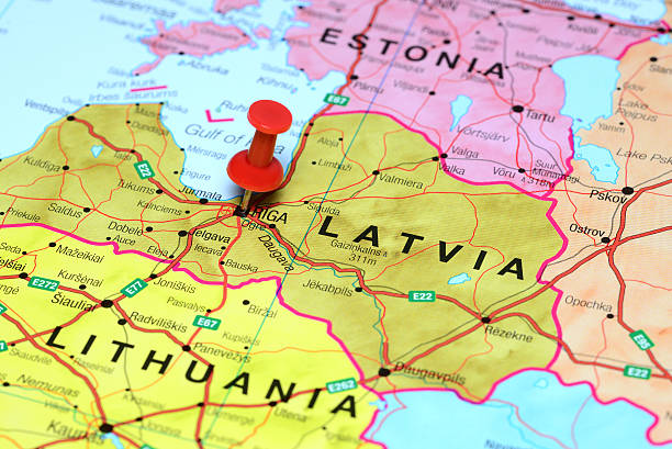 Riga pinned on a map of europe Photo of pinned Riga on a map of europe. May be used as illustration for traveling theme. baltic countries stock pictures, royalty-free photos & images