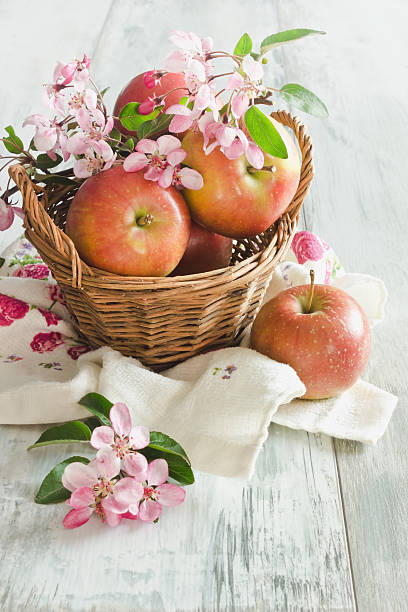 ripe apples in a basket stock photo