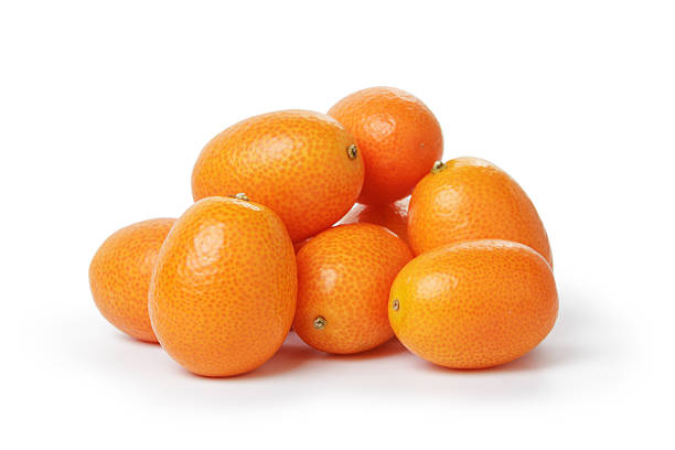 ripe kumquat fruits ripe kumquat fruits, isolated on white background kumquat stock pictures, royalty-free photos & images