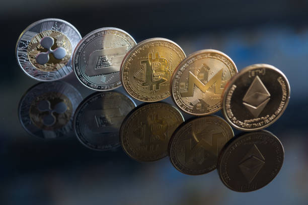 Ripple, Dash coin, Bitcoin, Monero and Ethereum Berlin, Germany, march 15, 2018: Cryptocurrency coins on the black mirror - Ripple, Dash coin, Bitcoin, Monero, Ethereum  With Ethereum  stock pictures, royalty-free photos & images
