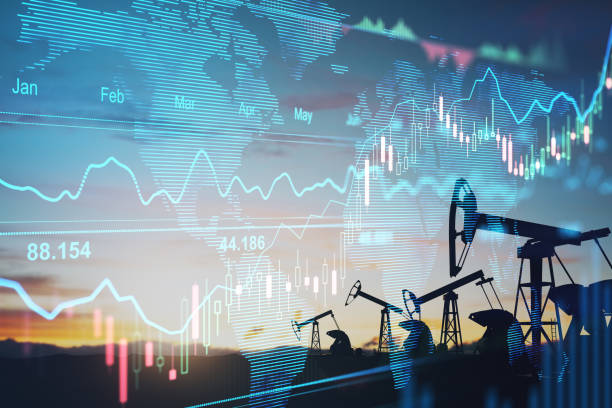 Rise in gasoline prices concept with double exposure of digital screen with financial chart graphs and oil pumps on a field. stock photo