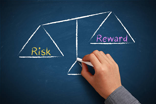 Risk and reward balance stock photo