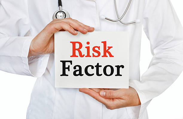 Risk Factor card in hands of Medical Doctor stock photo