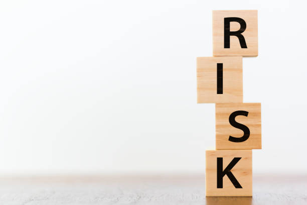 Risk word written on wooden cubes stock photo