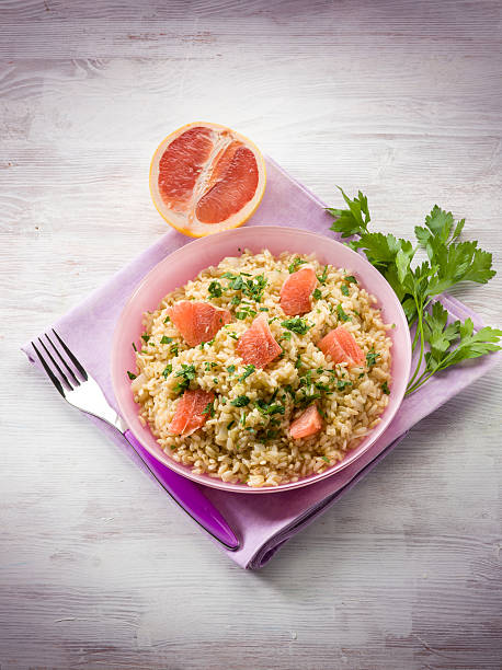 risotto with grapefruit and parsley stock photo