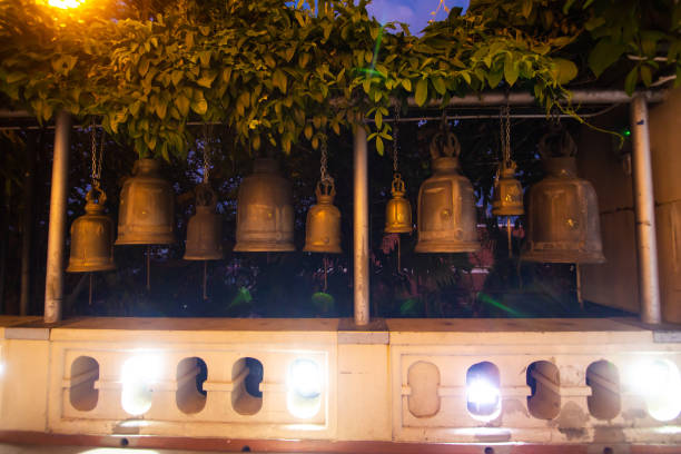 Ritual bells of different sizes in a Buddhist temple Bangkok/Thailand- 01/25/2017: Ritual bells of different sizes in a Buddhist temple. ayodhya stock pictures, royalty-free photos & images