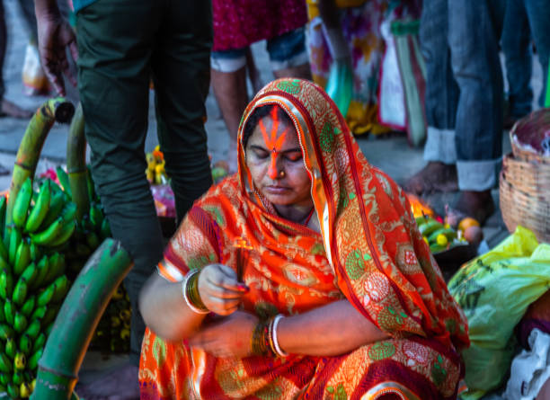 Rituals. April 11,2019. Kolkata. India. An unidentified Indian Bihari hindu woman worship River Ganga at Princep ghat. chhath stock pictures, royalty-free photos & images