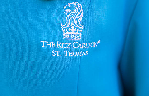 Ritz - Carlton St Thomas logo on  bell hop's uniform stock photo