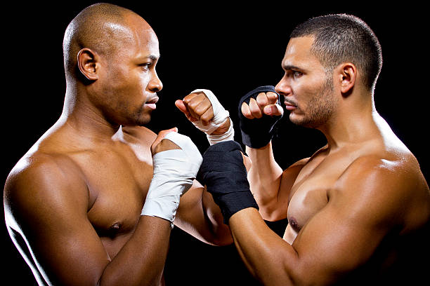 Rival Black and Latino Male Boxers or MMA Fighters stock photo