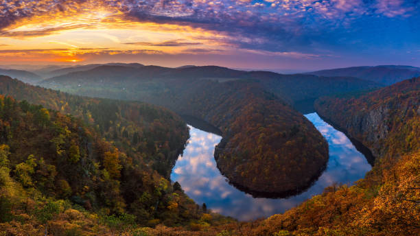 River canyon with dark water and autumn colorful forest. Horseshoe bend, Vltava river, Czech republic. Beautiful landscape with river River canyon with dark water and autumn colorful forest. Horseshoe bend, Vltava river, Czech republic. Beautiful landscape with river vltava river stock pictures, royalty-free photos & images