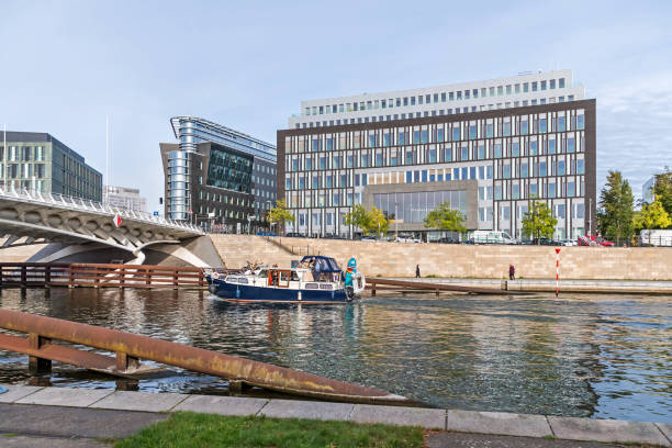 River Spree with the Kronprinzenbruecke and a federal news conference building in Berlin, Germany stock photo
