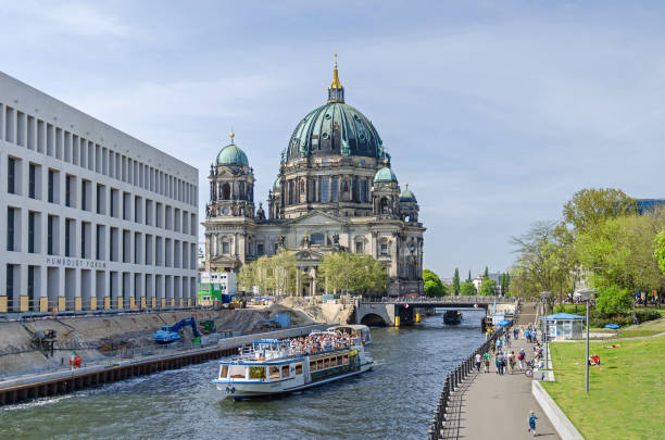 River Spree with tourist boats, Humboldt Forum under construction and Berlin Cathedral stock photo