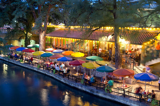 Tourist dining along the San Antonio River Walk in San Antonio,...