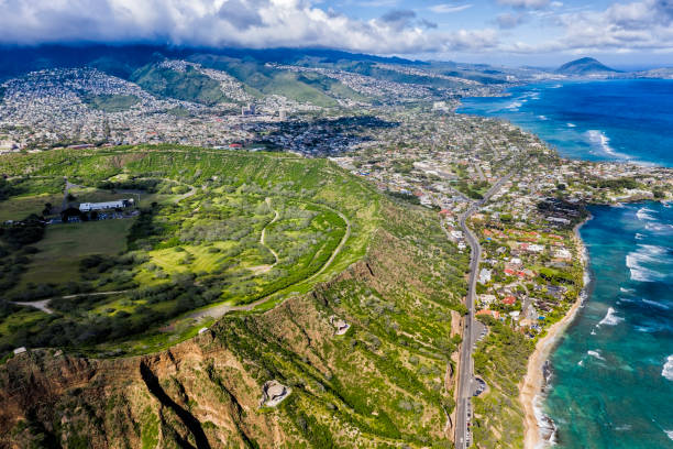 Road by the Diamond Head Mountain landmark and Honolulu suburbs, Oahu Hawaii stock photo