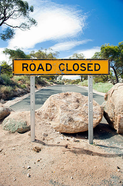 Road Closed Sign Road closed sign with large boulders on the road dead end road stock pictures, royalty-free photos & images
