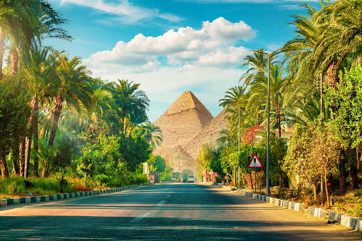 Great sphinx and pyramids under bright sun