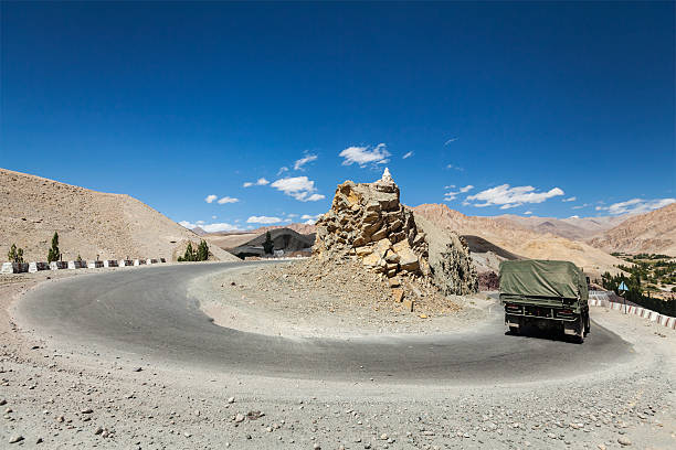 Road in Himalayas. Ladakh, India Road in Himalayas with army truck. Ladakh, India ladakh region stock pictures, royalty-free photos & images