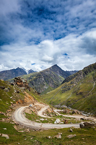 Road in Himalayas Road in Himalayas. Rohtang La pass, Lahaul valley, Himachal Pradesh, India mountain pass stock pictures, royalty-free photos & images