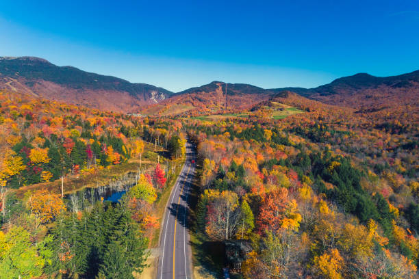 Road leading to ski resort in Stowe, Vermont. Aerial view with fall scenery stock photo