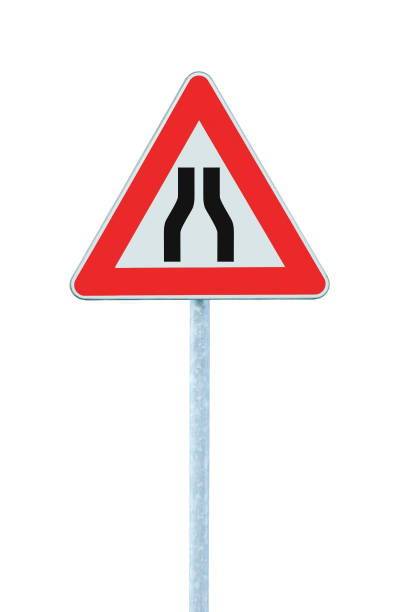 Road narrows road sign on pole post, red triangle frame, isolated vertical closeup stock photo