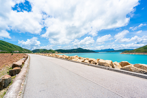 Road over the dam of the High Island Reservoir at the Hong Kong Global Geopark, Hong Kong