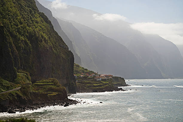 Road through cliffs on the north coast of Madeira stock photo