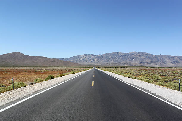 Road through the desert, California, USA stock photo