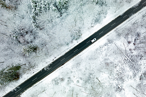 Road through wintery landscape - aerial view