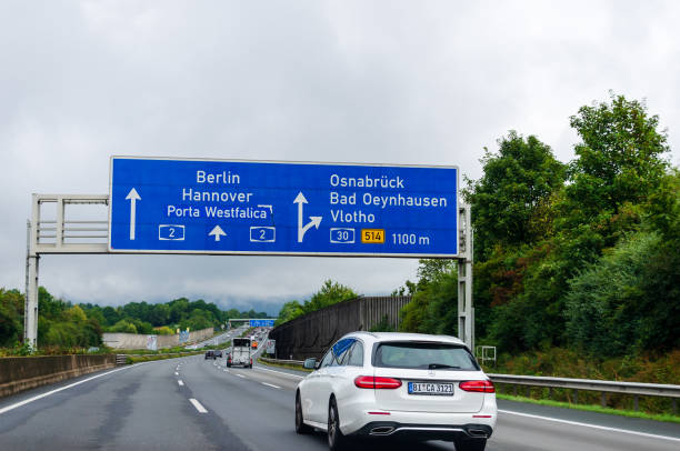 Road traffic on the German Highway (Autobahn, Bundesautobahn) A2 with road signs. stock photo