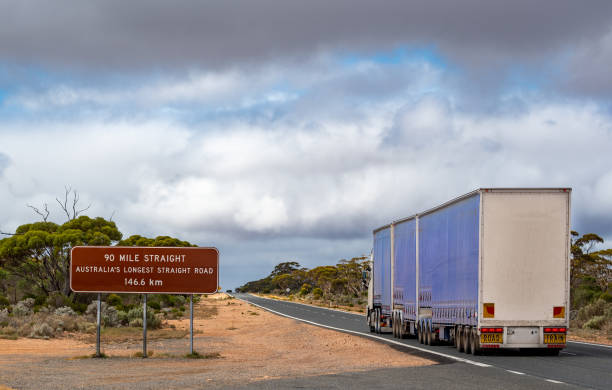 Road train on longest straight road in Australia in Nullarbor Plain stock photo