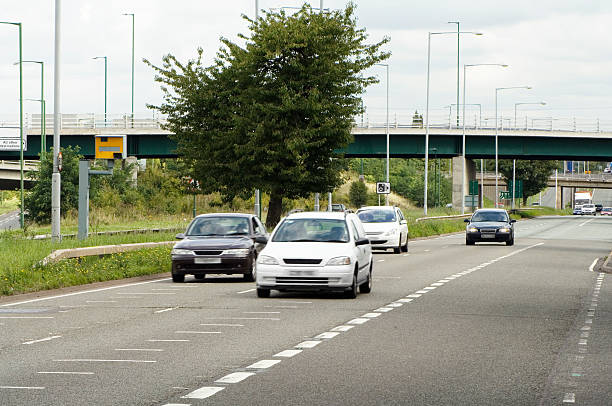 Road with Speed camera and cars Road with speed camera and cars. A45 near Bimingham NEC. road marking photos stock pictures, royalty-free photos & images